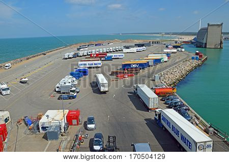 Hirtshals, Denmark - May 31, 2014: Trucks and buses waiting in the parking lot of the ferry terminal on the loading onto a ferry to Iceland and the Faroe Islands.