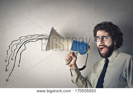 Man talks to megaphone but his voice lets low