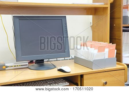 Computer monitor near the card index