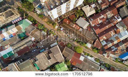 Aerial top view on railway in Bangkok in the slum area of Talat Phlu
