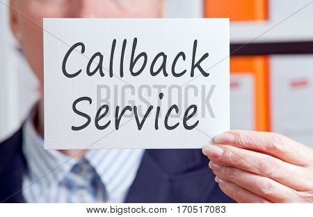 Callback Service - woman with sign in the office