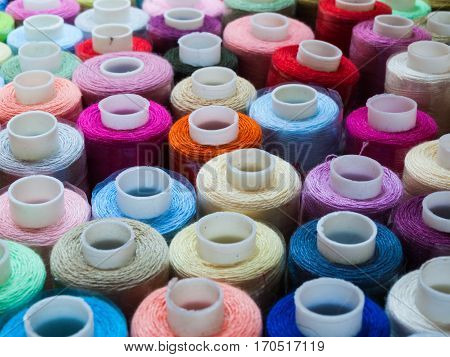 Hanks of multi-coloured threads and hanks for embroidery.