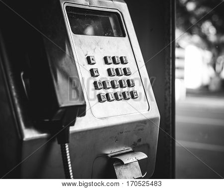 Payphone in phone box black and white