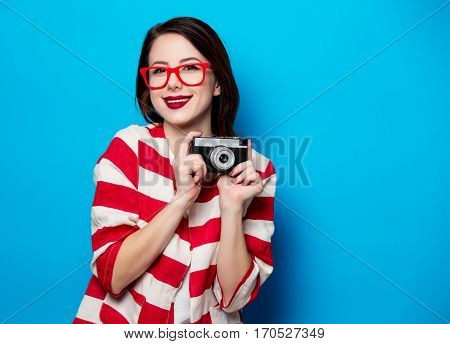 Young Smiling Woman With Retro Camera