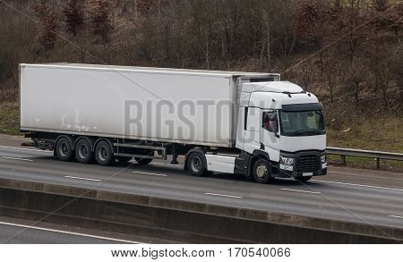 White lorry in motion on the British motorway
