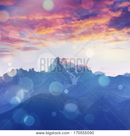 Snow-covered mountains in the mist. Autumn at Koruldi Lake. Europe, Georgia, Upper Svaneti, near mt. Ushba.