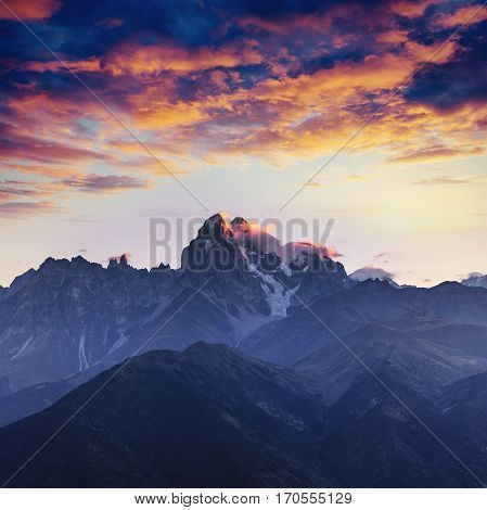 Snow-covered mountains in the mist. Autumn at Koruldi Lake. Europe, Georgia, Upper Svaneti, near mt. Ushba.