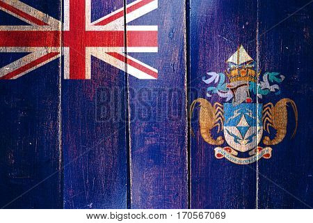 Vintage Tristan da cunha flag on grunge wooden panel