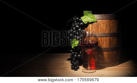 Glass Of Red Wine And Barrel On Wooden Table