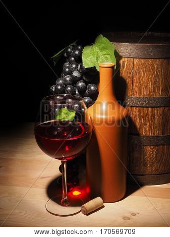 Glass Of Red Wine And Barrel On Wooden Table
