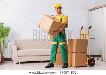 Transportation worker delivering boxes to house