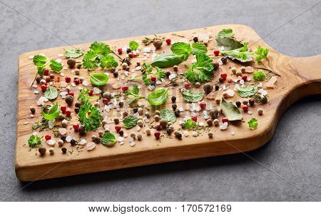 Herbs and spices  on a wooden board