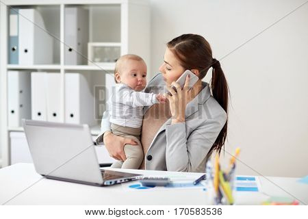 business, motherhood, multi-tasking, family and people concept - smiling businesswoman with baby calling on smartphone at office