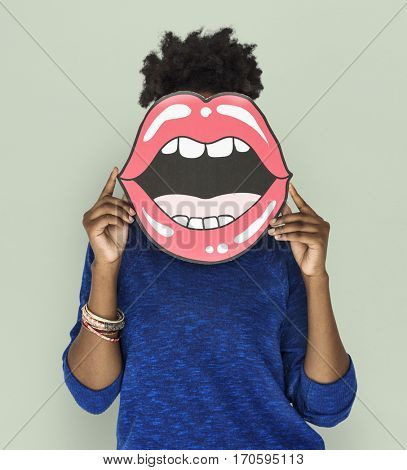 African Woman holding Paper Mouth Over her Face