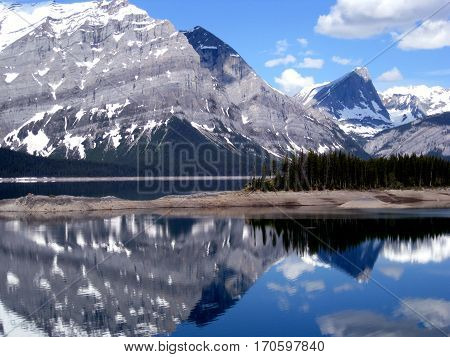 View across lake to Rocky Mountain range