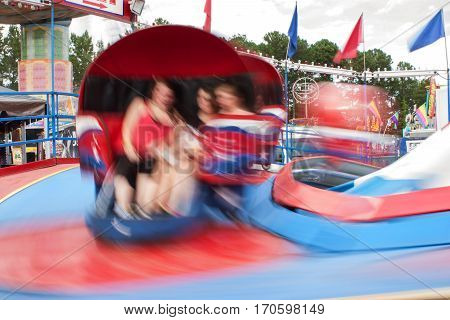 LAWRENCEVILLE, GA - SEPTEMBER 2016:  Motion blur shows movement of fast-moving carnival ride at the Gwinnett County Fair in Lawrenceville GA on September 17 2016.