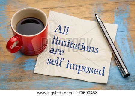 all limitations are self imposed - inspirational statement on a napkin with a cup of coffee