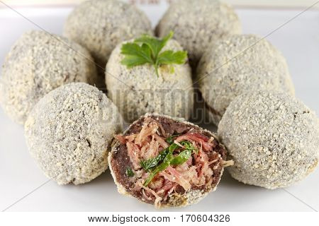 black beans balls fried  stuffed dried meat