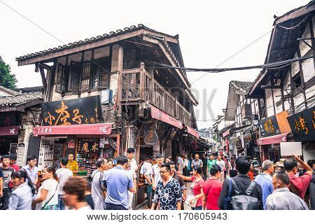 Chongqing China September 15 2015 : Unidentified tourists are walk for shopping in Ciqikou city of ancient and historical shophouses