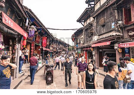 Chongqing China September 15 2015 : Unidentified tourists are walk for shopping in Ciqikou city of ancient and historical shophouses