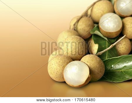 Longan group and leaf on orange solid background