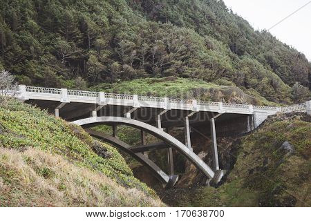 Stone bridge on Oregon coast on the Pacific Coast Highway. Summer spring or fall day setting.