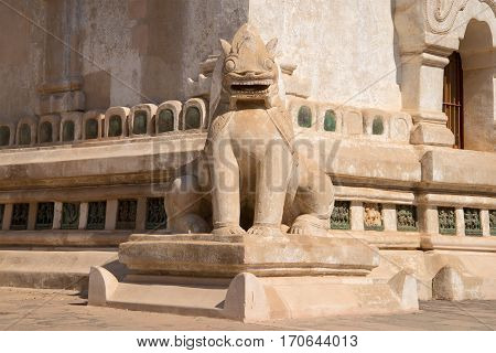The old sculpture of a mythical monster in the design of a Buddhist temple of Ananda Phaya. Bagan, Myanmar