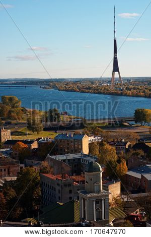 RIGA, LATVIA - OCTOBER 16, 2016: View to the river Daugava and Riga TV tower. Built in 1979-1986, the tower is 386.5 m tall and is the tallest built structure in Baltic countries