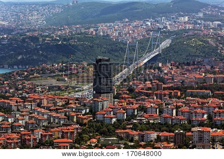 ISTANBUL, TURKEY - JUNE 30, 2012: Cityscape with Le Meridien Istanbul Etiler hotel and Fatih Sultan Mehmet Bridge. Completed in 1988, is was the second bridge across Bosporus strait