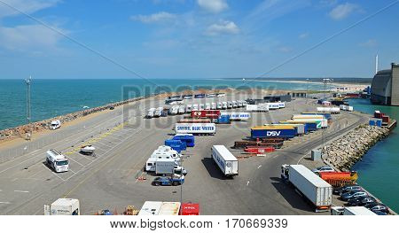 Hirtshals, Denmark - May 31, 2014: Trucks and buses waiting in the parking lot of the ferry terminal on the loading onto a ferry to Iceland and the Faroe Islands.