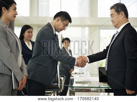 Business Partners Introductionary Handshake Bow
