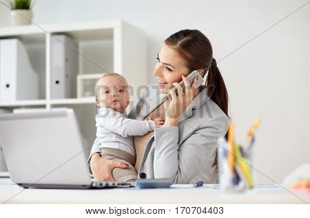 business, motherhood, multi-tasking, family and people concept - happy smiling businesswoman with baby calling on smartphone at office