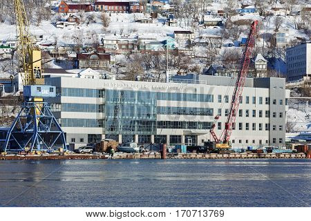 PETROPAVLOVSK-KAMCHATSKY CITY KAMCHATKA PENINSULA RUSSIA - DECEMBER 31 2016: Winter view of new modern building of Marine Station in commercial sea port Petropavlovsk-Kamchatsky on Avacha Bay.