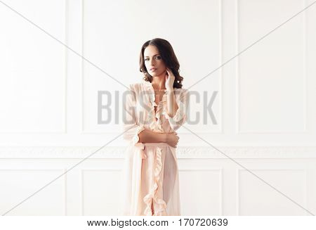 Fashion shoot of beautiful woman in dressing gown. Fashion, vogue, glamour concept.