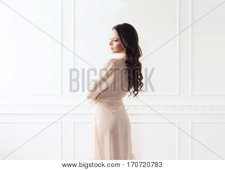 Fashion shoot of beautiful woman in dressing gown. Fashion, vogue, glamour concept.