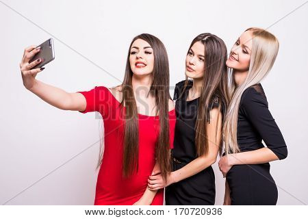 Three Models In Dresses Make Selfie.