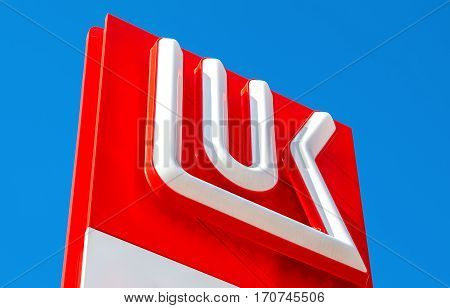 MOSCOW RUSSIA - JULY 11 2016: The emblem of the oil company Lukoil against the the blue sky. Lukoil is one of the largest russian oil companies