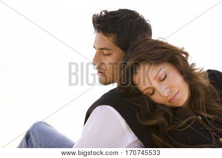 Portrait of a beautiful Hispanic couple laughing and smiling.