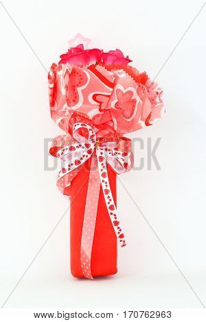 Red plastic flowers on a white background.