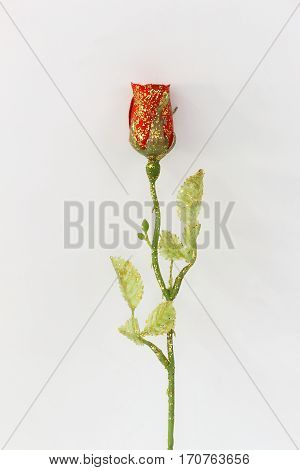 Plastic red roses on a white background.