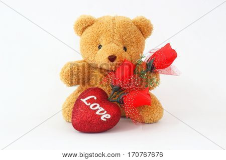 Brown teddy bears and red roses on a white background.