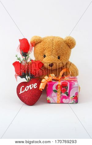 Brown teddy bear on a white background.