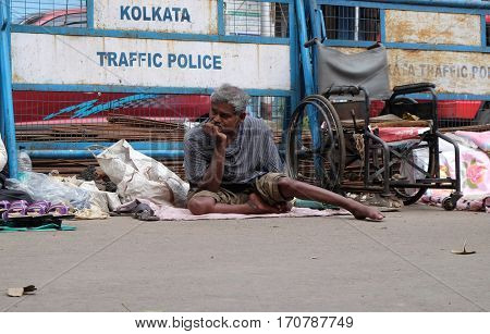 KOLKATA, INDIA - FEBRUARY 11: Beggars in front of Nirmal, Hriday, Home for the Sick and Dying Destitutes, established by the Mother Teresa and run by the Missionaries of Charity on February 11, 2016.