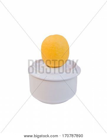 White ashtray with yellow lemon isolated on white.