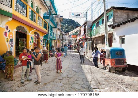 SAN PEDRO, GUATEMALA-DEC 24, 2015: Local people at main street  in San Pedro on Dec 24, 2015, Guatemala.