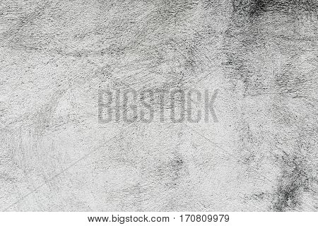 closeup of a rustic off-white plastered wall