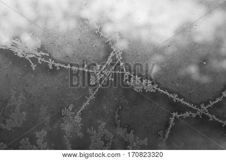 Belarus-October 13 2016 Frosty drawing on window glass drawing with frost on the window black and white image ottaevshee glass windows beautiful pictures the artist frostyin and yang