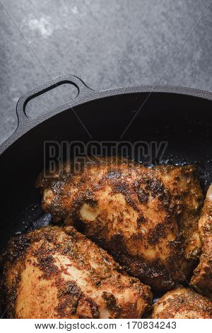 Butter Chicken in a sausepan on the slate closeup vertical