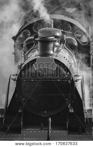 Restored Victorian Era Steam Train Engine With Full Steam In Black And White
