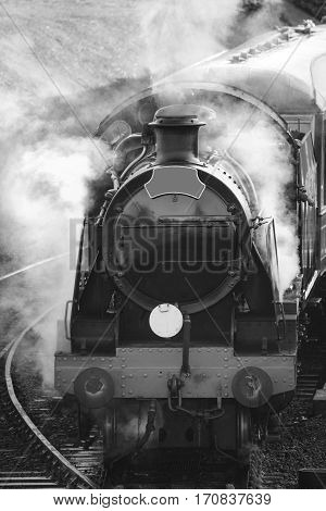 Restored Victorian Era Steam Train Engine With Full Steam In Black And White